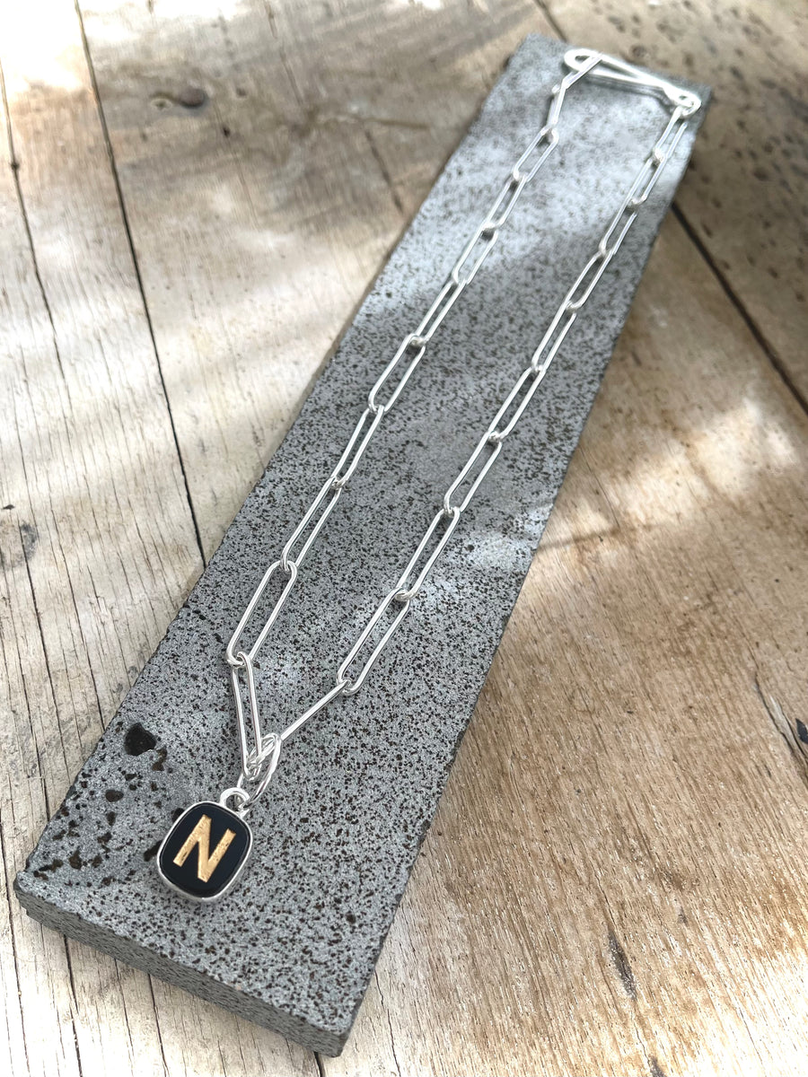 1930s glass letter pendant