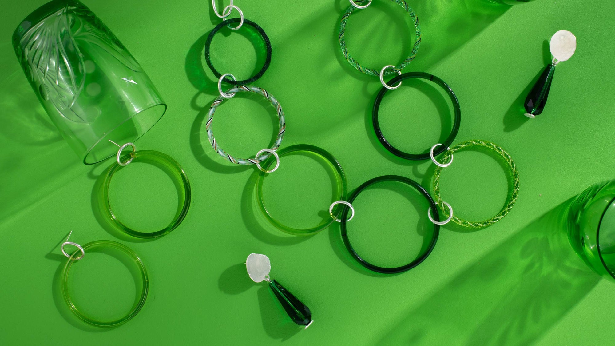 Green glass jewellery flat lay by Jacqueline Betsy Lord